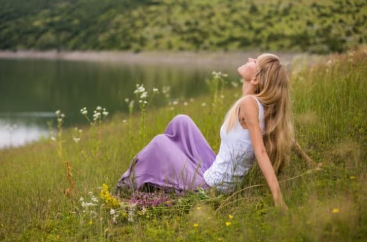 woman relaxing on grass