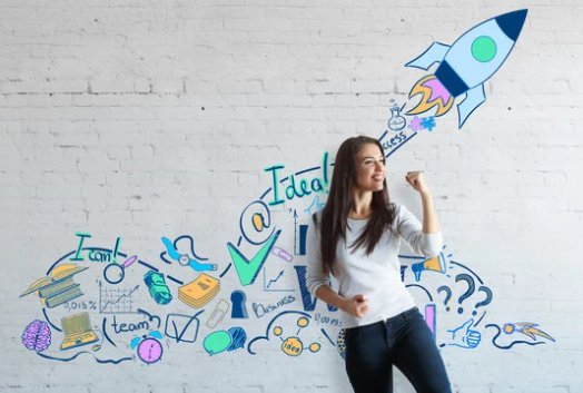 happy woman in front of a wall painted with grafiti