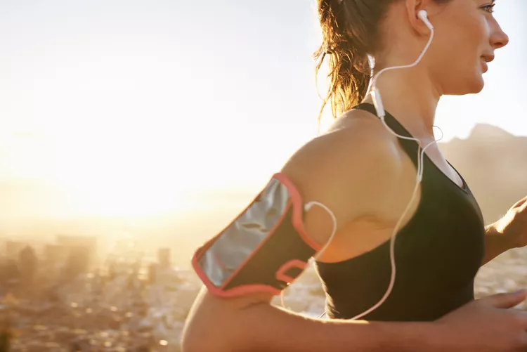 woman running with headphones